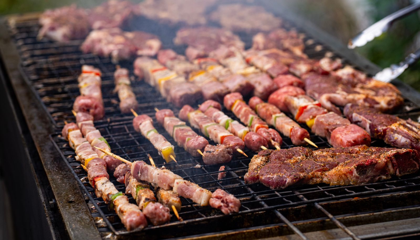 Reliable catering service with satisfied customers enjoying professionally prepared BBQ cuisine
